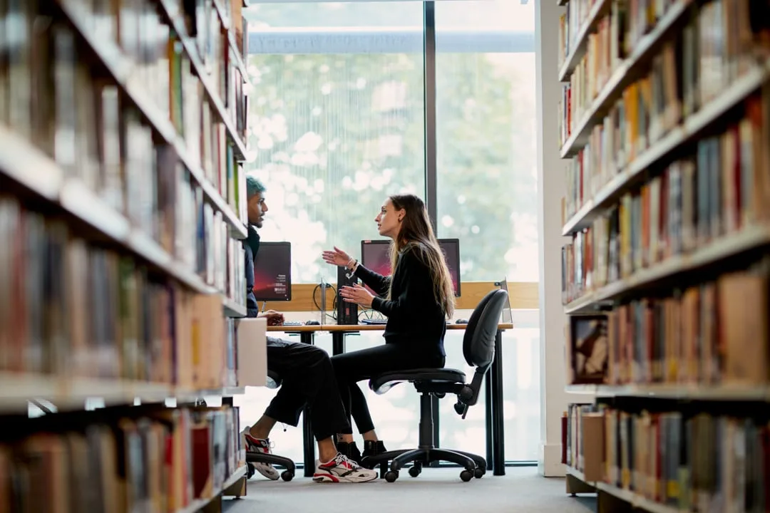 Students studying in the Bloomsbury Institute library